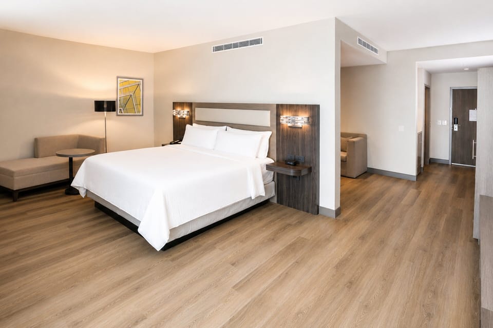 Suite, 1 King Bed | Desk, iron/ironing board, WiFi (free), bed sheets