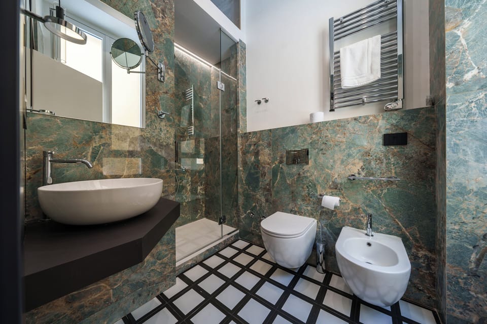 Superior Room | Bathroom | Shower, hair dryer, towels, soap