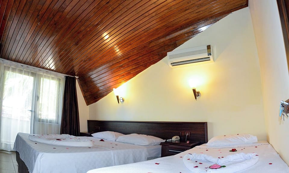 Standard Triple Room, City View | Blackout drapes, WiFi (free)