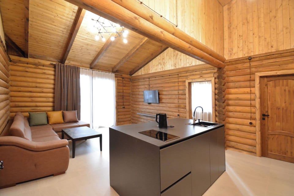 Luxury Bungalow, Mountain View | Living area | 100-inch Smart TV with cable channels, books, heated floors