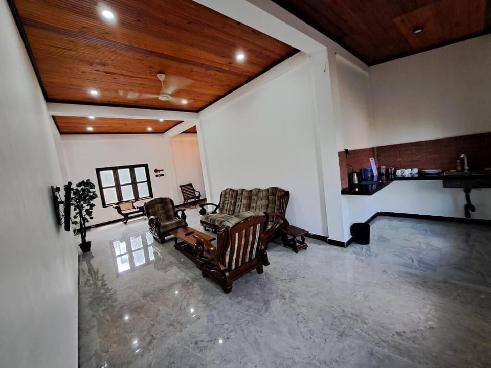 Comfort House, Balcony, Garden View | Living area | Flat-screen TV