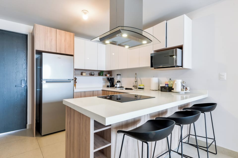 Family Suite, City View | Private kitchen | Full-size fridge, microwave, stovetop, blender