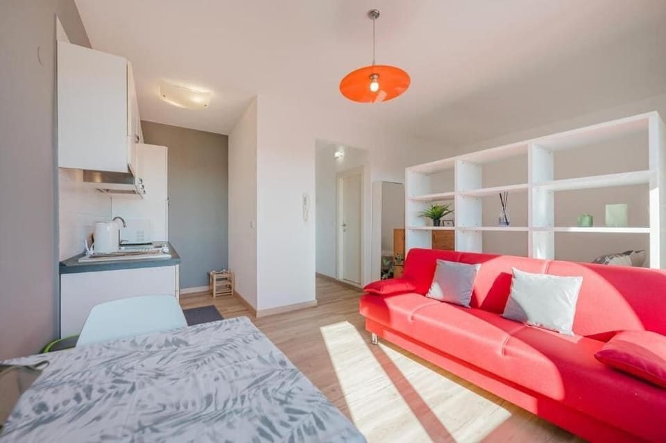 Deluxe Apartment | Living area | Flat-screen TV