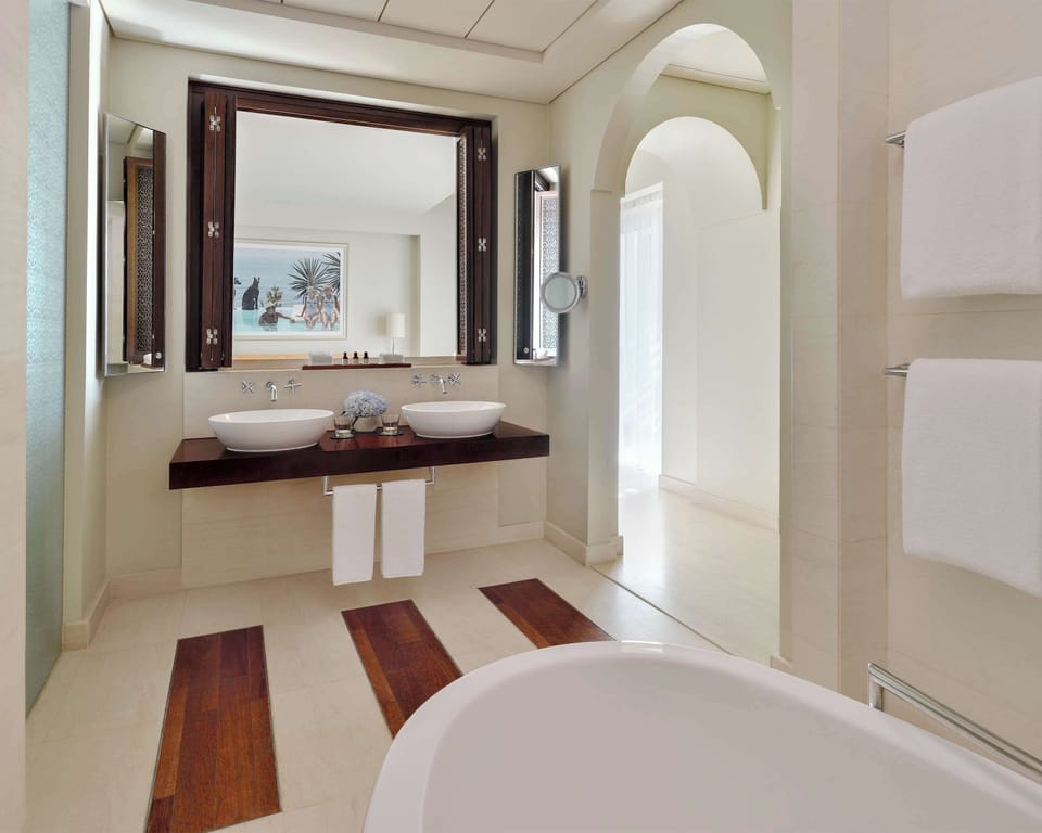 Deep soaking tub, designer toiletries, hair dryer, bathrobes