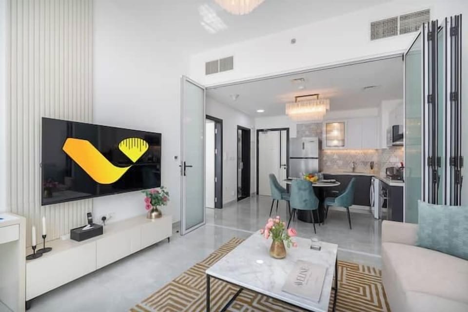 Luxury Apartment, Balcony, City View | Living area | 65-inch Smart TV with cable channels, foosball, table tennis