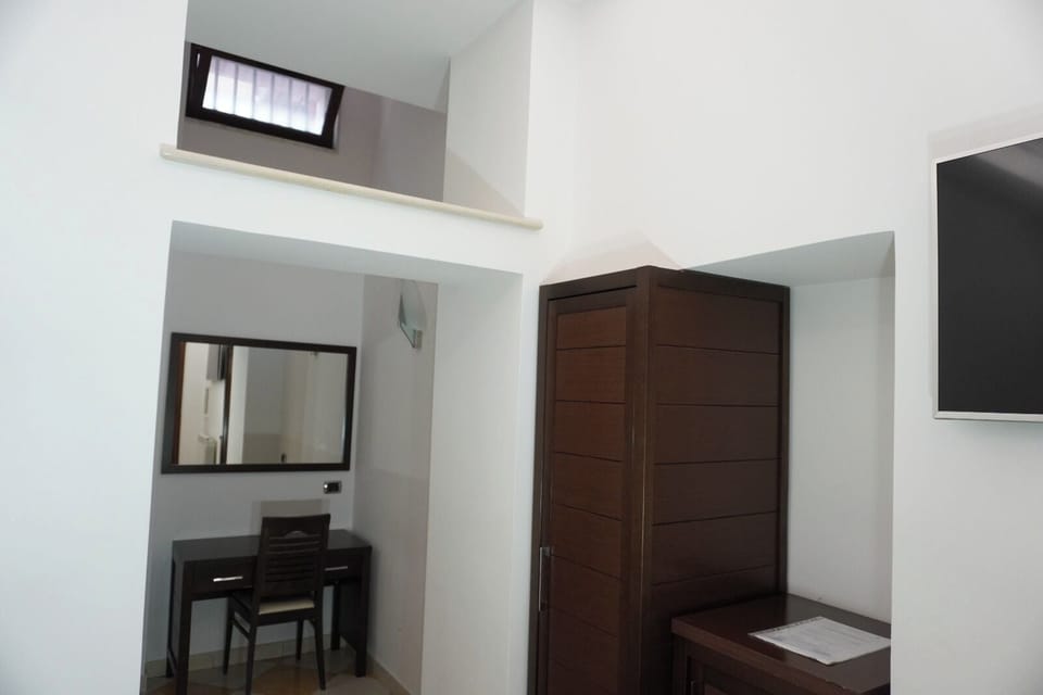 Superior Single Room 308 | Living area | 24-inch TV with cable channels