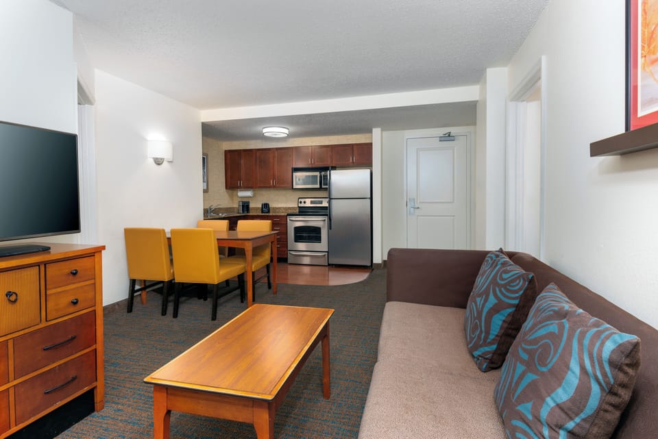 Premium bedding, desk, laptop workspace, blackout drapes