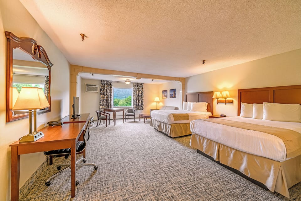 Junior Suite - 2 Queens, Non-Smoking (located over the lounge) | Desk, iron/ironing board (on request), WiFi (free), bed sheets