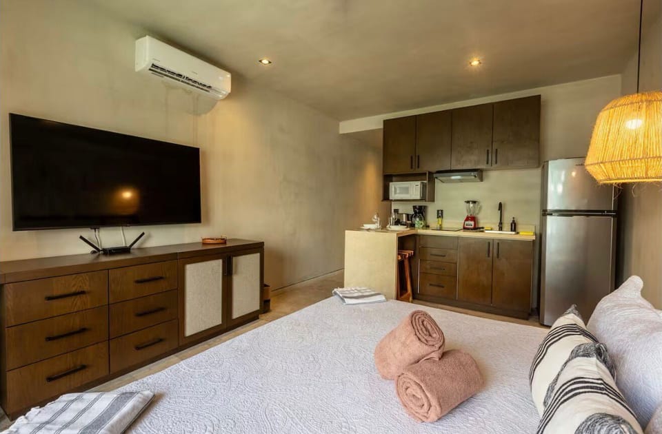 Deluxe Condo, Balcony, Pool View | In-room safe, laptop workspace, blackout drapes, iron/ironing board