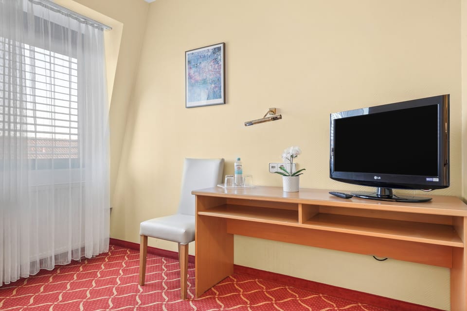 Comfort Double or Twin Room, City View | Desk, laptop workspace, blackout drapes, iron/ironing board