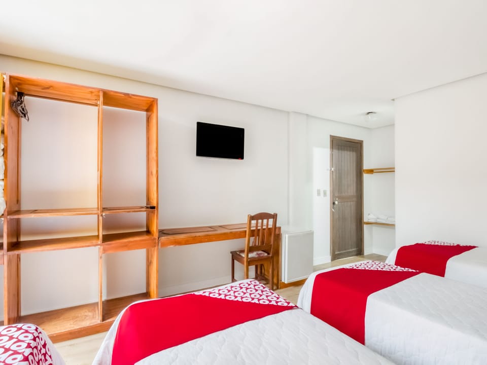 Economy Quadruple Room, Multiple Beds | Minibar, desk, iron/ironing board, free WiFi