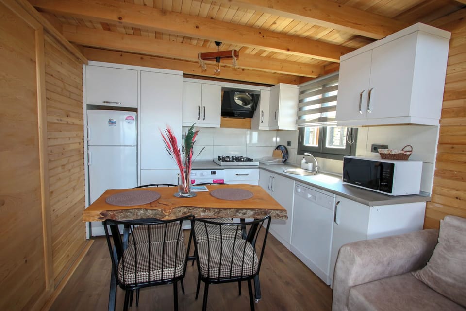 Honeymoon Bungalow, Balcony, Sea View | Private kitchen | Full-size fridge, oven, stovetop, dishwasher