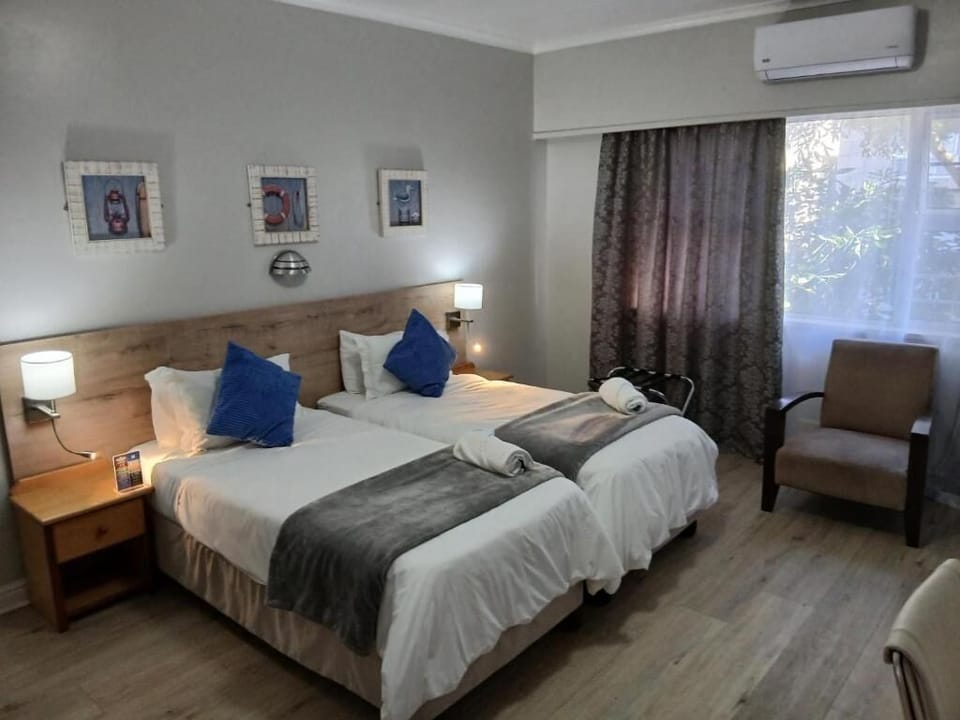 Luxury Twin Room, Patio | In-room safe, desk, blackout drapes, iron/ironing board