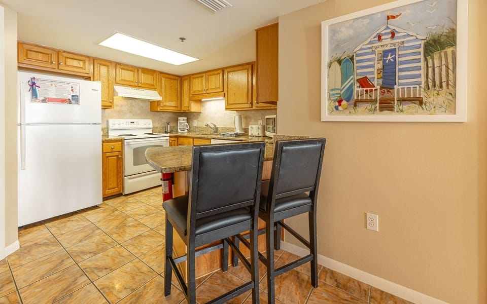 Condo, 2 Bedrooms | Private kitchen | Fridge, oven, coffee/tea maker