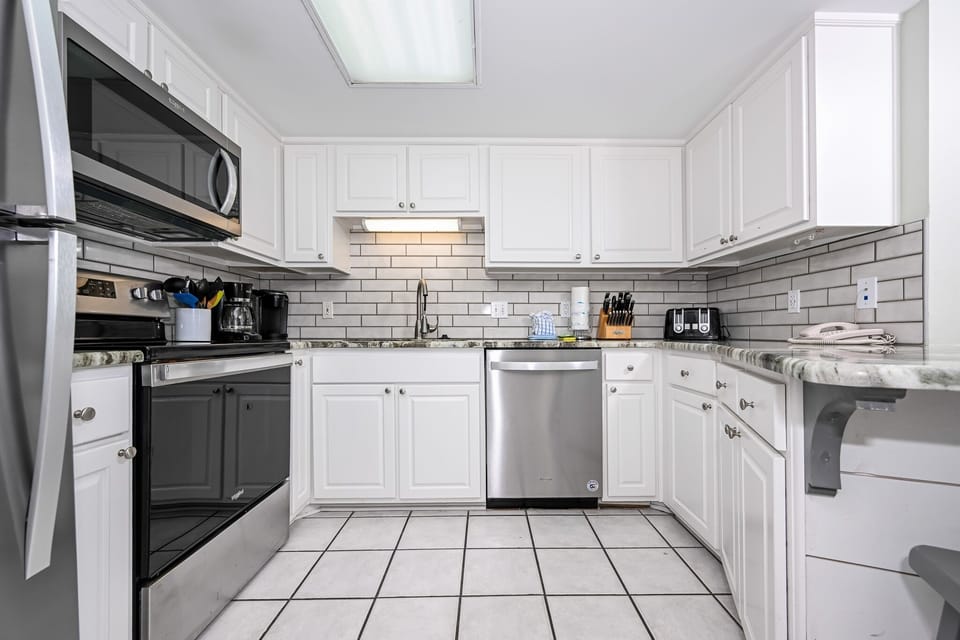 Condo, 2 Bedrooms | Private kitchen | Coffee/tea maker, fridge, oven