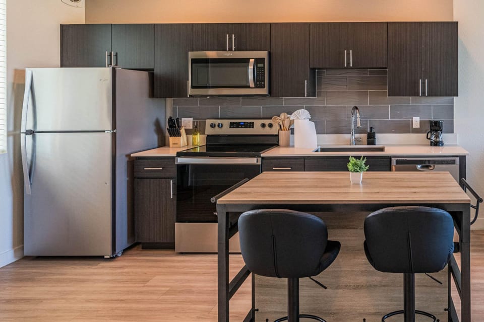 Deluxe Apartment, 2 Bedrooms | Private kitchen | Full-size fridge, microwave, oven, stovetop