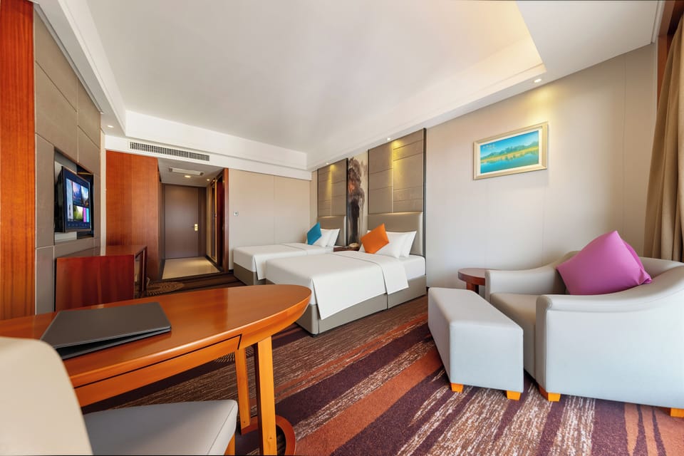 Superior Twin Room, Balcony, City View | Living area | 40-inch flat-screen TV with cable channels