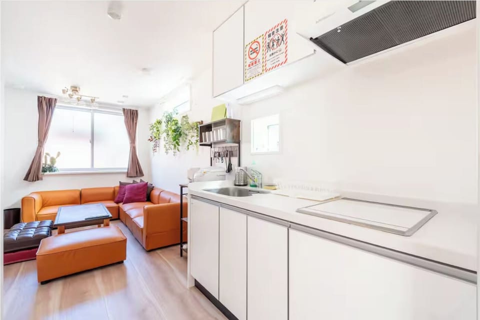 Family House, City View | Living area | Flat-screen TV
