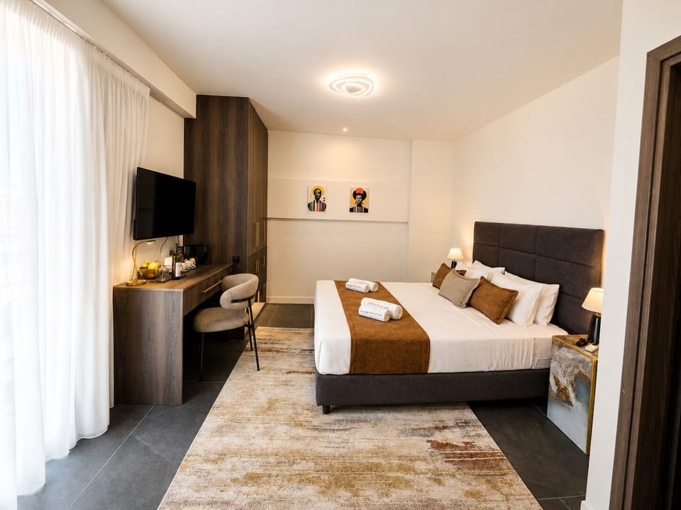 Deluxe Room with Balcony & Panoramic View | In-room safe, blackout drapes, iron/ironing board (on request)
