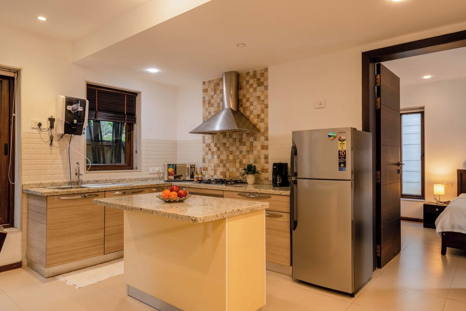 Villa, 3 Bedrooms, Pool View, Beachside | Private kitchen | Electric kettle, dining tables