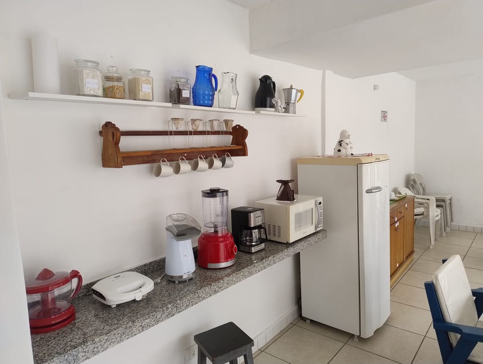 Full-size fridge, microwave, stovetop, cookware/dishes/utensils