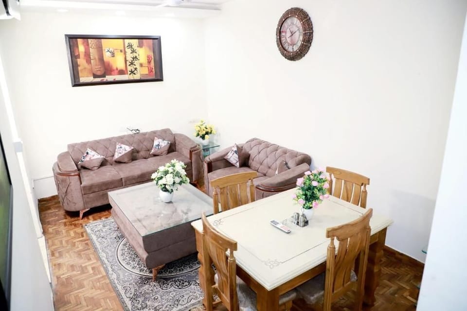 Apartment, Balcony, City View | Living area | 43-inch Smart TV with digital channels