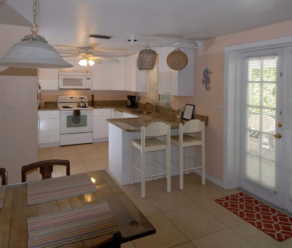 Full-size fridge, microwave, stovetop, coffee/tea maker