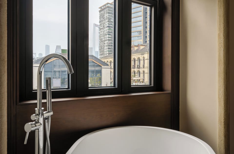 Superior Double Room, Bathtub, City View | Bathroom | Free toiletries, hair dryer, slippers, towels