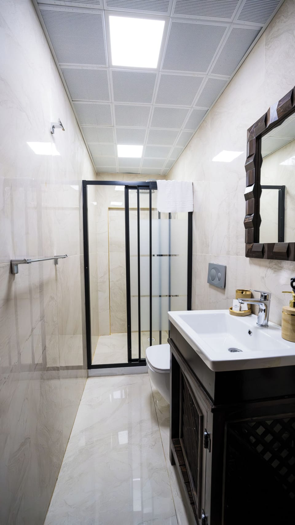 Shower, hair dryer, slippers, towels