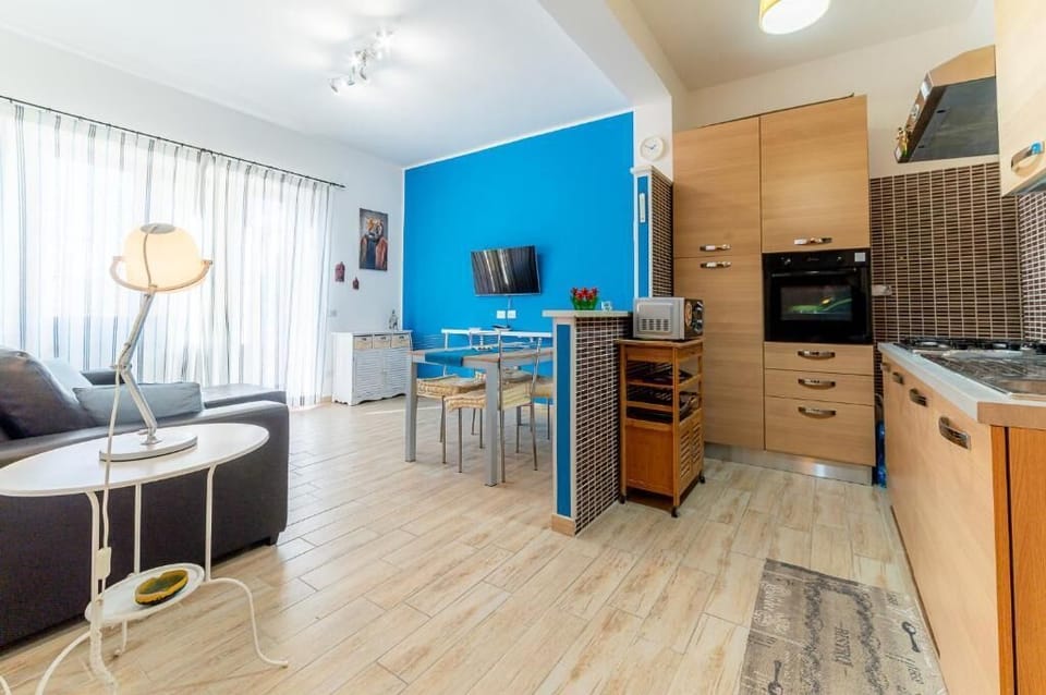 Apartment, Sea View | Living area | Flat-screen TV