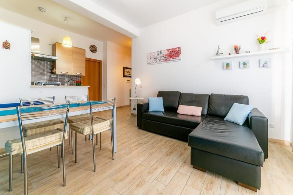 Apartment, Sea View | Living area | Flat-screen TV
