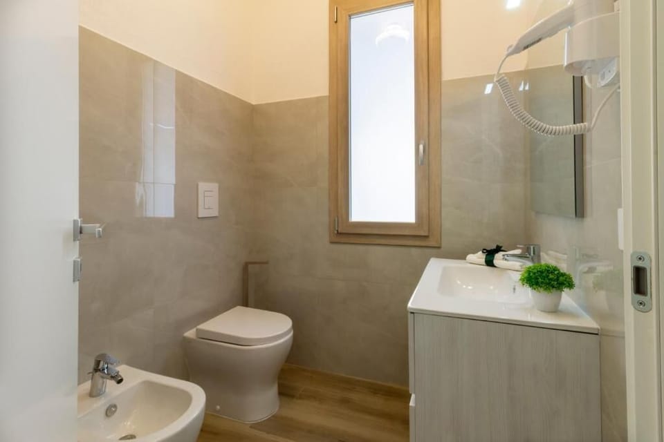 Double Room, Patio, Garden View | Bathroom | Shower, free toiletries, hair dryer, bidet