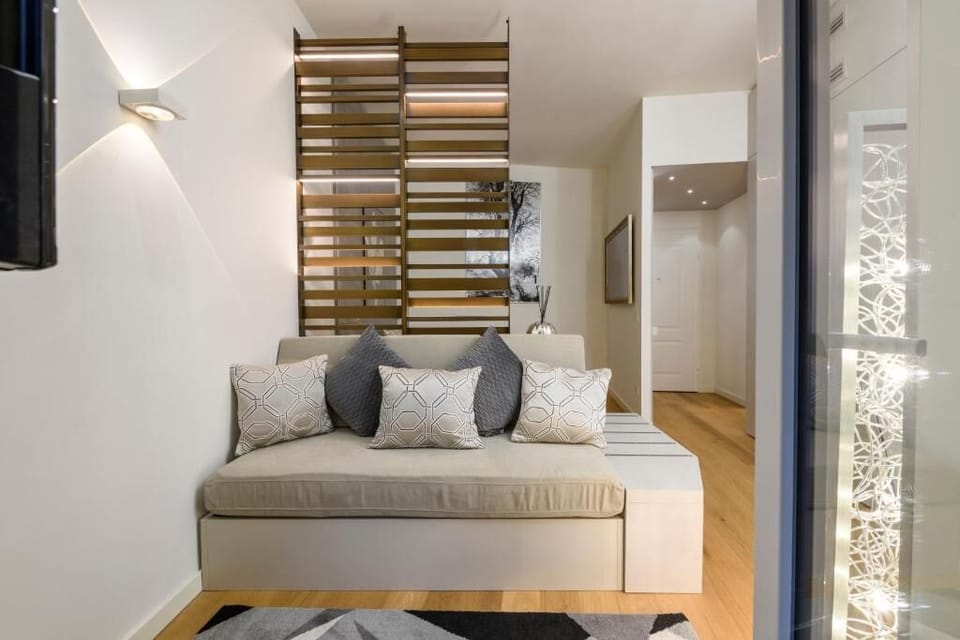 Deluxe Apartment, Balcony, Courtyard View | Living area | TV