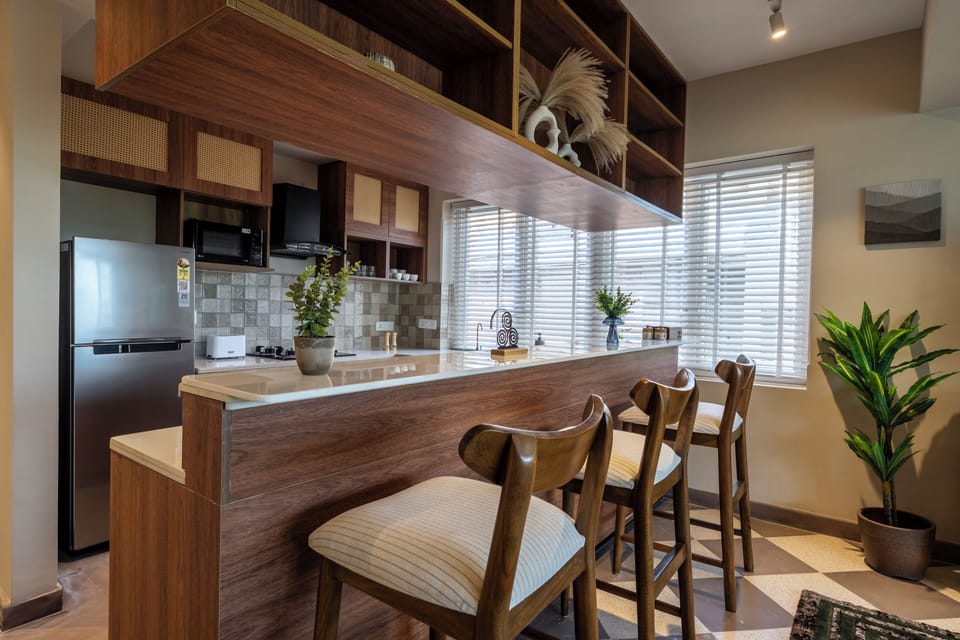 Apartment, 3 Bedrooms, Balcony | Private kitchen | Electric kettle, dining table