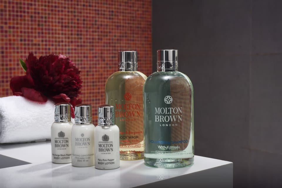 Shower, designer toiletries, hair dryer, bathrobes
