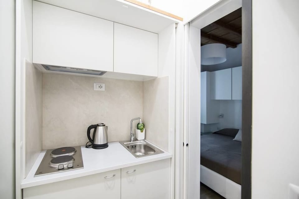 Deluxe Apartment, Kitchenette (Via Domenichino 5 - Rome) | Private kitchenette | Fridge, microwave, coffee/tea maker, toaster