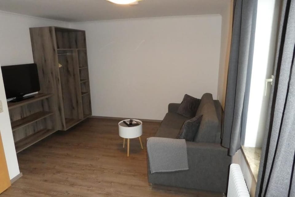 Comfort Double Room, Garden View | Living area | TV