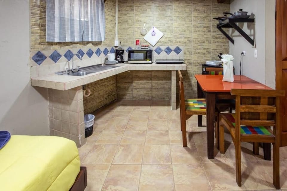 Family Quadruple Room, Patio, Garden View | Private kitchen