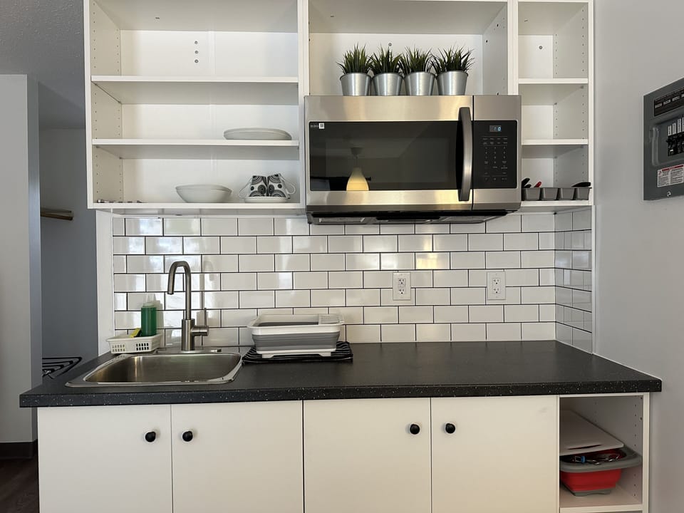 Standard Room, 1 Queen Bed, Kitchenette, Ground Floor | Private kitchen | Coffee/tea maker, fridge, microwave