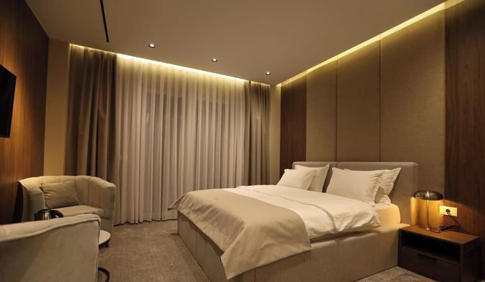 Deluxe Double Room, Balcony, Garden View | In-room safe, blackout drapes, free WiFi