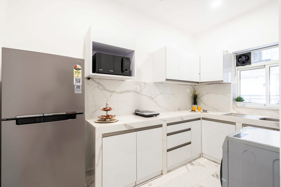 Apartment, 2 Bedrooms, Balcony | Private kitchen | Electric kettle, dining tables