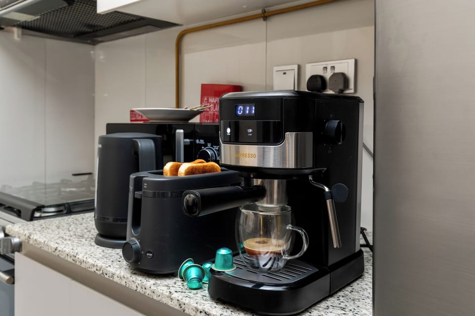 Luxury Apartment, Balcony, City View | Coffee and/or coffee maker