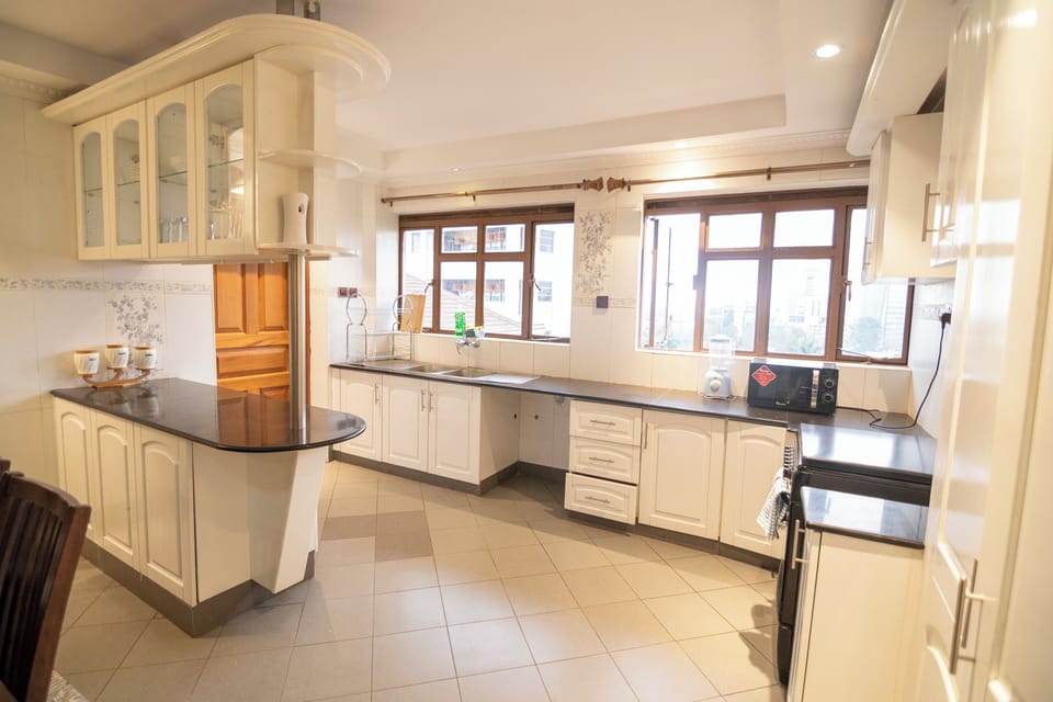 Family Apartment, City View | Private kitchen | Fridge, microwave, cookware/dishes/utensils