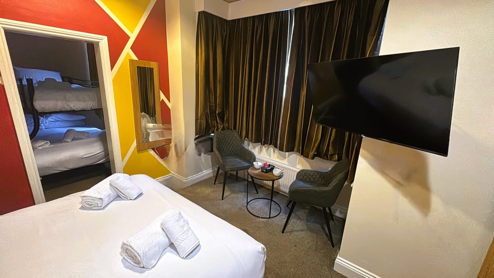 Standard Quadruple Room, Partial Sea View | Desk, iron/ironing board, free WiFi, bed sheets