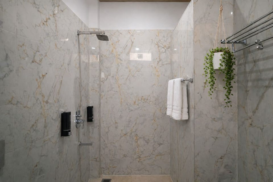 Twin Room | Bathroom | Shower, slippers, towels, soap