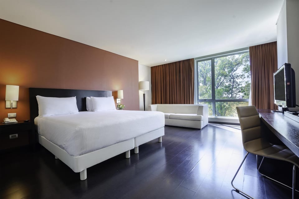 Premium bedding, down comforters, pillowtop beds, minibar