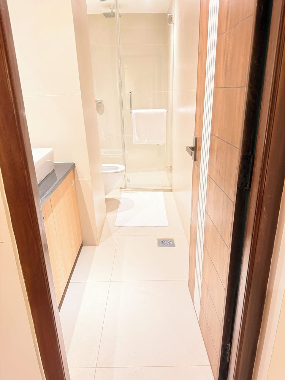 Shower, hair dryer, slippers, towels