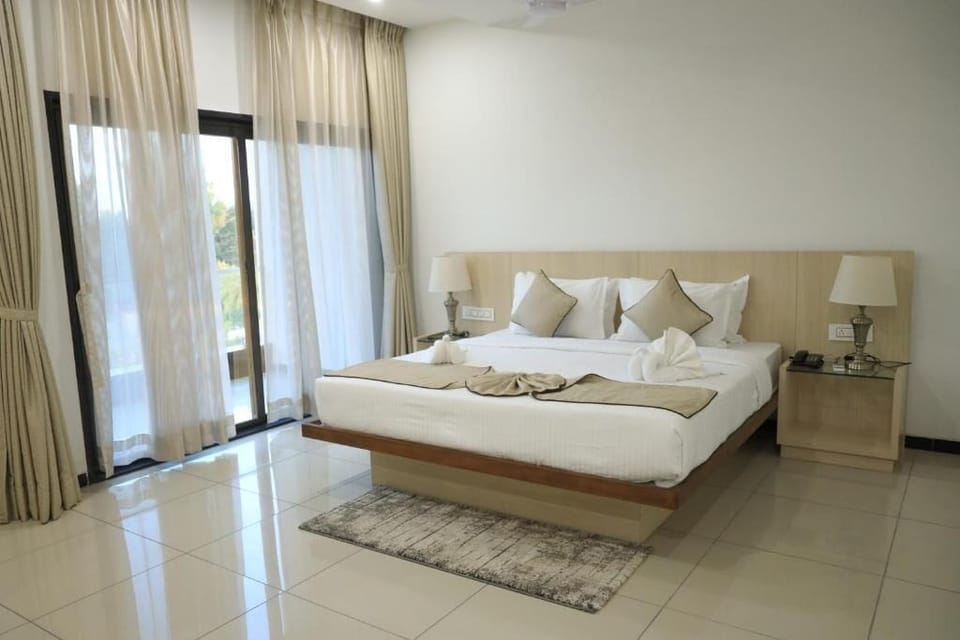 Suite, Balcony, Pool View | In-room safe, desk, soundproofing, iron/ironing board