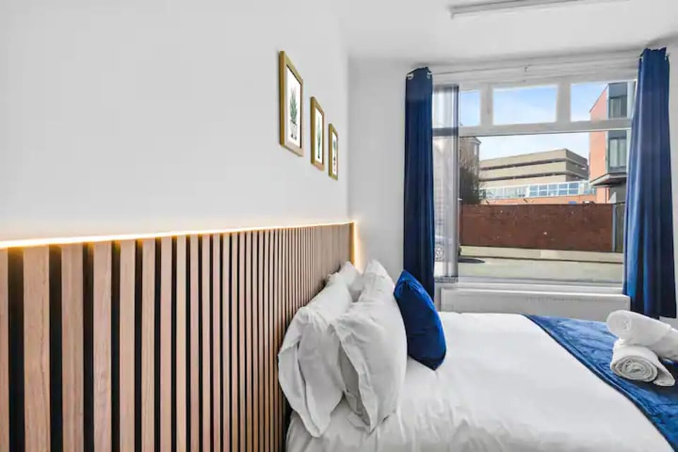 Deluxe Studio Suite | Laptop workspace, iron/ironing board