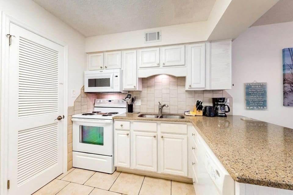 Signature Condo, 2 Bedrooms, Beachfront | Private kitchen | Fridge, microwave, oven, stovetop